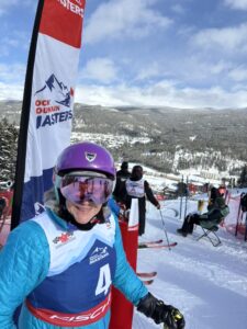 Photo of Lydia Young at the top of Rocky Mountain Masters race course